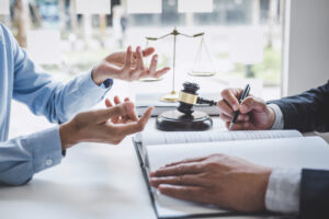 SOLICITOR DISCUSSING DOG BITE COMPENSATION CLAIMS WITH A CLIENT