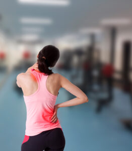 A woman has injured her back and neck in the gym