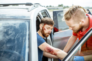 A motorist is treated for car accident injuries.