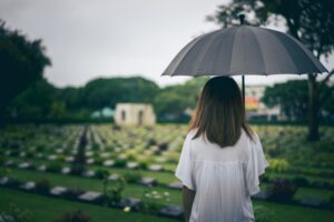 A young woman at a cemetary after losing a loved one in a fatal accident