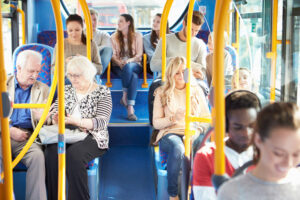 Bus passengers travelling on bus.