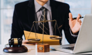 Solicitor seated at desk explaining negligence claims to a client.