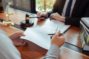 A personal injury solicitor offers free legal advice to their client about legal costs and explains how to seek compensation 
