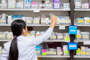 A pharmacist checks the correct prescription for patient safety 