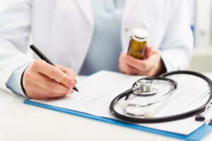Doctor writing a report of medical negligence to be used as evidence in a claim.