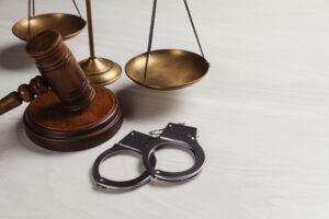 Handcuffs and gavel representing how much compensation for prison injury claims.
