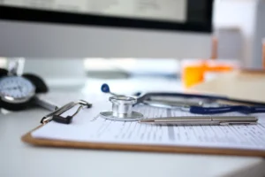 A stethoscope on top of a patient's medical notes