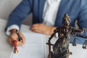 A medical negligence solicitor completing paperwork at a desk as part of the claims process