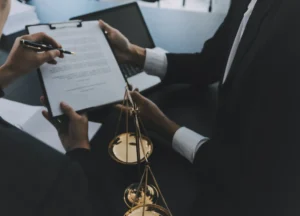 Solicitors examine paperwork for a medical negligence compensation claim